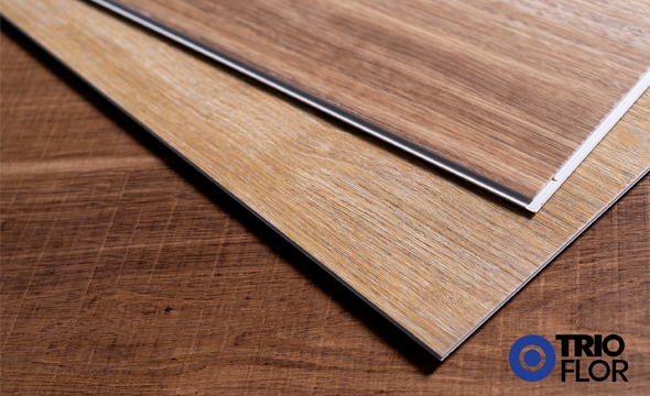 While searching for the perfect vinyl flooring, you’ve probably come across the terms SPC and WPC. Wanting to learn the differences and compare SPC vs WPC vinyl? You’re in the right place.  Both options are known for being 100% waterproof. SPC vinyl is a newer product with a signature rigid core that is virtually indestructible. WPC vinyl has been the gold standard for vinyl flooring and features a waterproof core that’s comfortable as well as functional.  In this head-to-head showdown, discover the pros and cons of SPC and WPC, learn how they’re made, and even compare the cost, durability, and comfort.