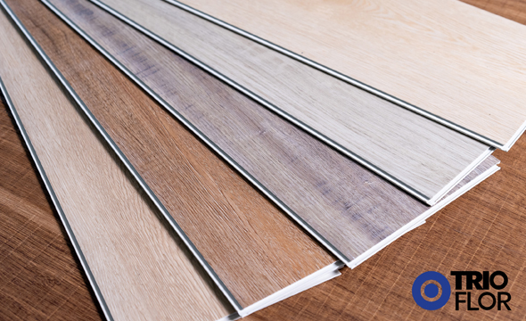 If you have been shopping for flooring recently or even if you are in the flooring industry you have probably noticed the massive influx of vinyl flooring options that have flooded the marketplace in recent years. While vinyl flooring is not a new category, many of its latest incarnations are. You might be familiar with acronyms such as VCT (vinyl composite tile) or LVT (luxury vinyl tile), but it seems like every manufacturer likes to come up with new terms and acronyms with every product release, and there has been no consensus historically of what those acronyms really mean. A few examples of this include the acronyms WPC and SPC. When we first started seeing these new flooring types emerge into the marketplace in 2012, many manufacturers referred to WPC as “wood plastic composite” because of a small amount of wood fiber mixed into the expanded foam core. Likewise, SPC was largely referred to “stone plastic composite” or “solid plastic composite” because of the limestone content within the solid core. Both were also referred to as “rigid core”.