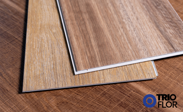 With so many different types of vinyl flooring on the market, it can be hard to figure out which one will be best for your project and needs. When it comes to rigid core construction, WPC and SPC vinyl floors are very similar. The main differences lie within the construction of the planks. Below we will outline the main similarities and differences of WPC vs SPC vinyl flooring.  WPC vs SPC Vinyl Differences Plank Thickness – Most WPC vinyl floors will be thicker than a standard SPC vinyl. WPC vinyl flooring usually ranges from 5mm to 8mm, while and SPC vinyl will stay around 4mm to 6mm.  Comfort Under Foot – Due to the construction of the rigid cores, the WPC vinyl will be softer on the foot than an SPC vinyl. WPC vinyls use a foaming agent within the core to give it added cushion. An SPC vinyl is most limestone with little fillers and adhering agents. This gives the SPC vinyl floor a more sturdy feel under foot. With an added underlayment, your SPC vinyl will have a softer feel under foot.  Dent Resistance – With an SPC vinyl core being primarily stone based, it will give the floor a more superior dent resistance versus a WPC vinyl. The WPC vinyl is dent resistant, however, it is a softer floor construction that will not be as resilient. An SPC vinyl floor would be the best choice in commercial applications due to this factor.  Temperature Fluctuations – If you’re dealing with drastic temperature fluctuations, such as a cabin that is unheated in the winter, an SPC vinyl will have superior performance over a WPC vinyl. Going back to the core construction, an SPC vinyl’s stone make up and dense structure makes it less susceptible to movement than a WPC vinyl option.  Price –  Typically, a SPC vinyl will be more affordable than a WPC vinyl. Different features, such as attached underlayments or special wear layers will vary the prices.  WPC vs SPC Vinyl Similarities Appearance – Both WPC and SPC vinyl floors have very realistic surfaces. With improved digital printing technology available today, most vinyl floors will have a beautiful look and feel. Find WPC and SPC vinyls with a variety of decors, styles, colors and textures.  Application – Like most vinyl flooring options, WPC and SPC vinyl can be installed below, on and above grade. They can be installed in wet areas, such as kitchens and bathrooms, as well as commercial spaces.  Installation – Rigid core vinyls are click lock floors that are DIY friendly. WPC and SPC vinyl flooring have a tongue and groove construction that clicks together with no need for glues or nails.  Maintenance & Cleaning – Cleaning and maintenance is a breeze with WPC and SPC vinyl flooring. Regular sweeping mixed with occasional deep cleaning is all you need to keep these floors looking great.